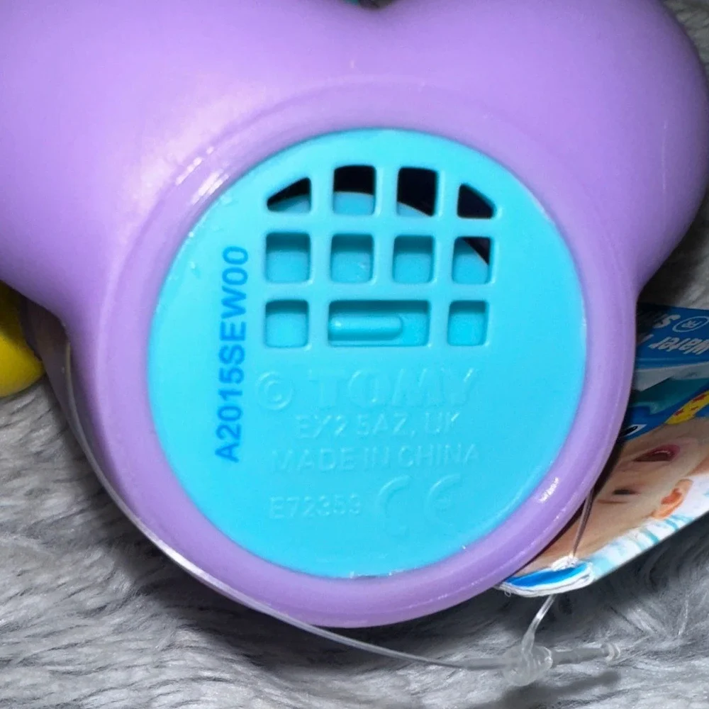 TOMY Water Whistlers Purple Dolphin Bath Toy E72379 Squirter Whistle 9m+
